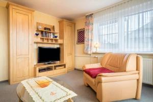 TV a/nebo společenská místnost v ubytování Ferienwohnung 1