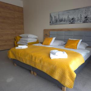 Ένα ή περισσότερα κρεβάτια σε δωμάτιο στο Apartament 319 Czarna Góra