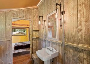 a bathroom with a sink and a mirror at Celtic Escapes in Narberth