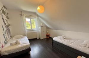 Postel nebo postele na pokoji v ubytování Vogelgarten - Villa 10 couchages entre vignes et chants d'oiseaux