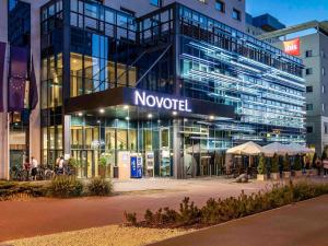 a building with a novation sign in front of it at Novotel Lodz Centrum in Łódź