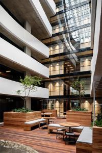 a building with tables and benches in a courtyard at Apartment with Mountain views Wex1 in Cape Town