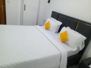 Ένα ή περισσότερα κρεβάτια σε δωμάτιο στο Jambo inn Apartment