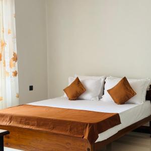 Ένα ή περισσότερα κρεβάτια σε δωμάτιο στο Green Villa Matale