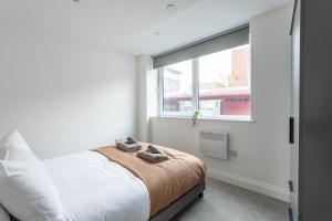 En eller flere senge i et værelse på George House - Wakefield