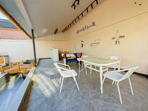 Et opholdsområde på Nanshan Ski Resort - Nanshan Muxue Homestay