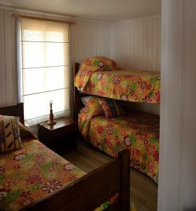 Ένα ή περισσότερα κρεβάτια σε δωμάτιο στο Cabañas Aguasmarinas