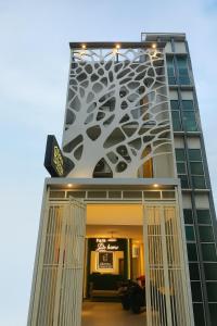 a building with a sign on the side of it at The One Residence Tanah Abang in Jakarta