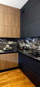 Kuchyň nebo kuchyňský kout v ubytování Le Galeriste - parking inclus