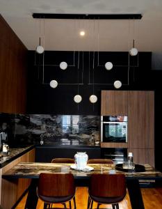 Kuchyň nebo kuchyňský kout v ubytování Le Galeriste - parking inclus