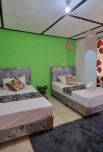 Postel nebo postele na pokoji v ubytování Kenya Retreat