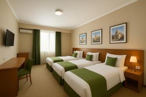 Ένα ή περισσότερα κρεβάτια σε δωμάτιο στο Level Deluxe Hotel