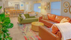 a living room with couches and a dining room at Rainbow River Bungalow with Early Checkin! in Dunnellon