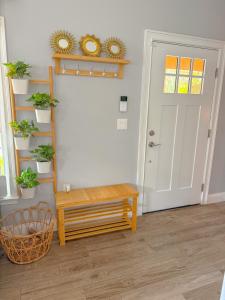 a room with a wooden bench and a door at Rainbow River Bungalow with Early Checkin! in Dunnellon +24 photos