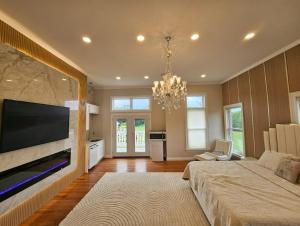 a large living room with a large flat screen tv at Luxury Estate for Filming in Gaithersburg +49 photos