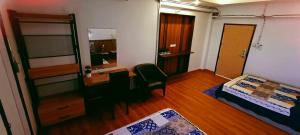 Ένα ή περισσότερα κρεβάτια σε δωμάτιο στο Bamboo Residence