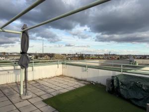 a patio with an umbrella on a roof at City Dachterassen Traum in Vienna