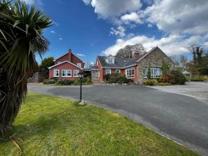 a house with a driveway in front of it at Hillview House, Donegal Town in Donegal
