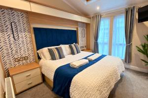 Postel nebo postele na pokoji v ubytování Vintage 95 - Southview Holiday Park Skegness + 14 fotografií