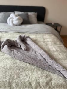 a blanket on top of a bed at Kutak mira in Belgrade