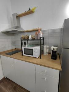 a microwave on a counter in a kitchen at La Ginestra in Bastia