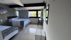 Ένα ή περισσότερα κρεβάτια σε δωμάτιο στο Êxito Loft