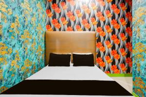 Ένα ή περισσότερα κρεβάτια σε δωμάτιο στο Hotel O Shotel