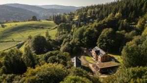an aerial view of a house in a forest at Apartmány Hraničná s privátním wellness in Bedřichov +131 photos