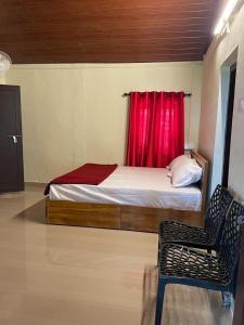 Voodi või voodid majutusasutuse Wayanad Campaign Parudeesa toas