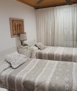 Postel nebo postele na pokoji v ubytování Casa vitorianet