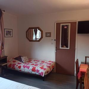 Ένα ή περισσότερα κρεβάτια σε δωμάτιο στο Chambres d'hôtes