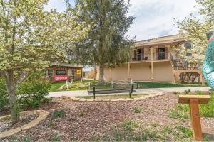 a park bench in front of a building at Cozy Cub Den in Bryson City +25 photos