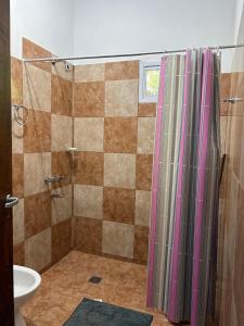 a bathroom with a shower and a sink at Dos Osos in Villa General Belgrano +4 photos