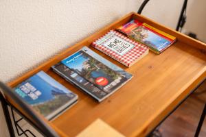 a table with three dvds on top of it at Sun & Roses in Funchal +20 photos