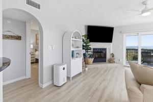 a living room with a couch and a fireplace at Bermuda Run 10 in Saint Augustine Beach