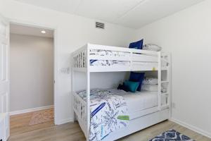 a bedroom with two bunk beds in a room at Bermuda Run 10 in Saint Augustine Beach +44 photos