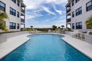 a swimming pool in front of a building at Bermuda Run 10 in Saint Augustine Beach