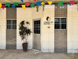 a building with a sign that readsliving do music at Residencial Junino do Mestre - Casa 66 in Caruaru