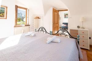 Ένα ή περισσότερα κρεβάτια σε δωμάτιο στο Casa vacanze Le More