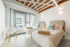 Ένα ή περισσότερα κρεβάτια σε δωμάτιο στο LAR Tamaduste