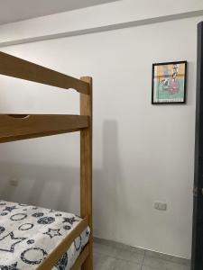 Ένα ή περισσότερα κρεβάτια σε δωμάτιο στο Hostal Marina