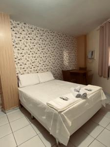 Postel nebo postele na pokoji v ubytování Pousada Central