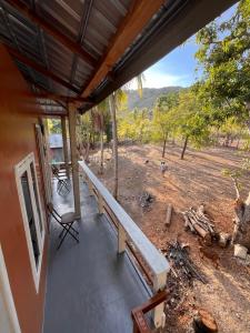 a porch of a house with a view of a field at Modo home in Komodo
