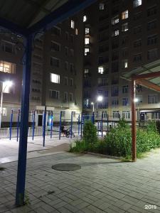 a night time view of a building with lights at Action Djal in Bishkek +6 photos