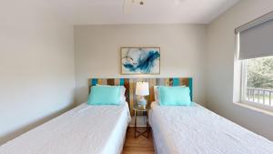 Postel nebo postele na pokoji v ubytování Palmettobay#2, 2 Bedroom4 Twin Beds Park2 Cars