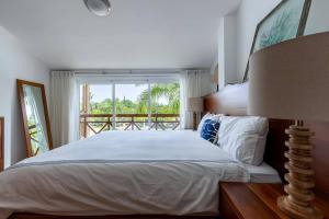 a bedroom with a large bed and a window at Fortunity Club- Playa Dorada, Pto Plata in Sampiño +258 photos