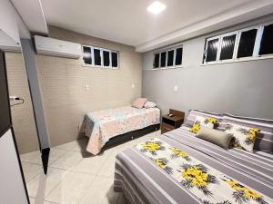 Postel nebo postele na pokoji v ubytování Apartamento a 1 km da Orla de Atalaia