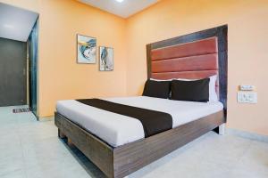 Ένα ή περισσότερα κρεβάτια σε δωμάτιο στο Hotel O Kumar's Amantran Lodging