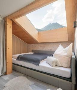 Ένα ή περισσότερα κρεβάτια σε δωμάτιο στο Stubainest Schmidt Ferienwohnung