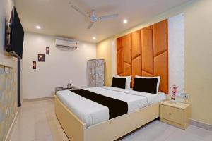 Postel nebo postele na pokoji v ubytování Hotel O Ace